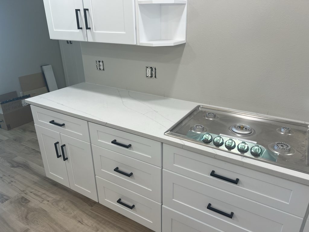Kitchen countertop installation during a home remodel by Black Diamond Builders.