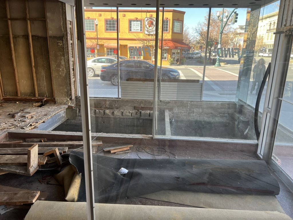Renovation stage at Don Joquin Street Tacos, featuring open space and construction work with an exterior view of the street.